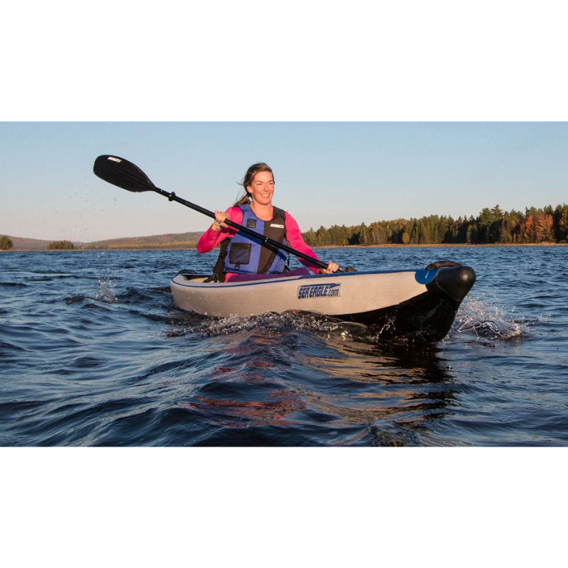 Sea Eagle RazorLite 393RL Inflatable Kayak Woman kayaking on a lake with trees in the background
