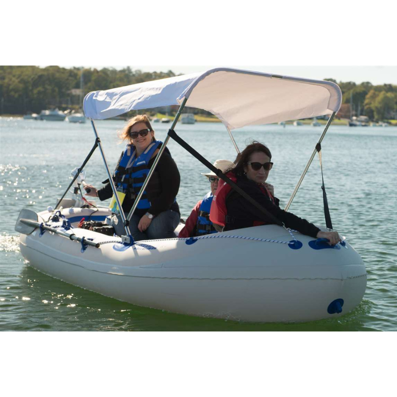 Sea Eagle SE9 Motor Mount Inflatable Boat Three people in a small inflatable boat with a canopy on a lake.