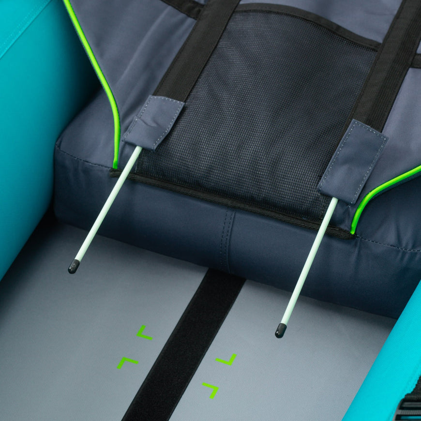 Close-up of a blue and gray bag with green accents on a teal background